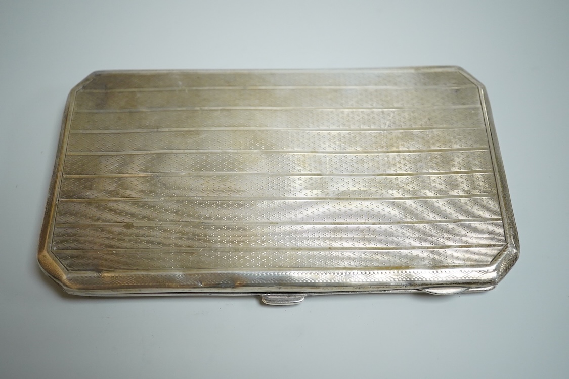 A George V silver rectangular cigarette case, with canted corners, Henry Matthews, Birmingham, 1926, 14.3cm, 6oz.